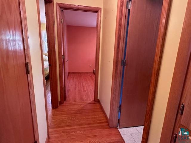 hallway with light wood-type flooring