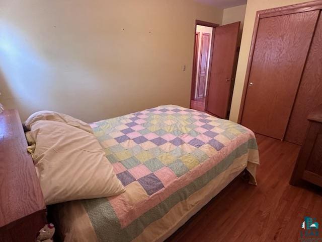 bedroom featuring hardwood / wood-style flooring