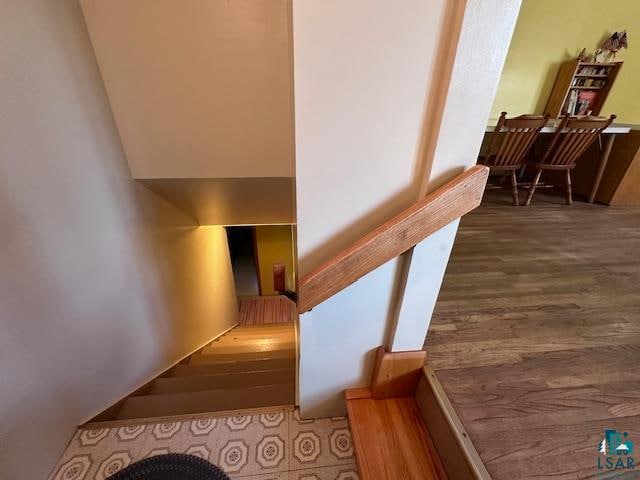 stairway featuring hardwood / wood-style flooring