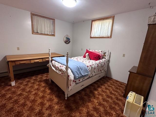 bedroom featuring dark colored carpet