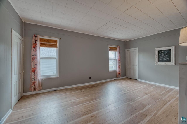 unfurnished room featuring light wood-type flooring