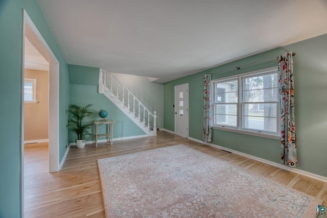 entryway featuring light wood-type flooring and a healthy amount of sunlight