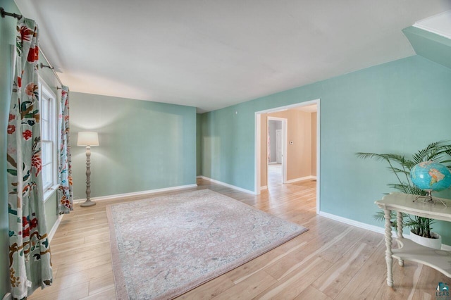 unfurnished room with light wood-type flooring