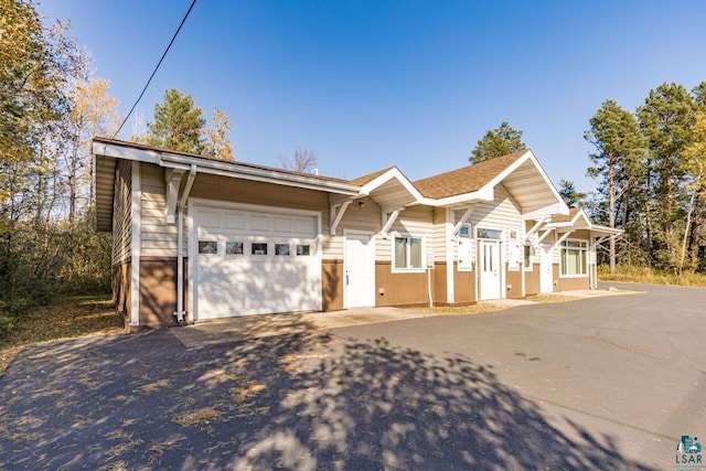 ranch-style home featuring a garage