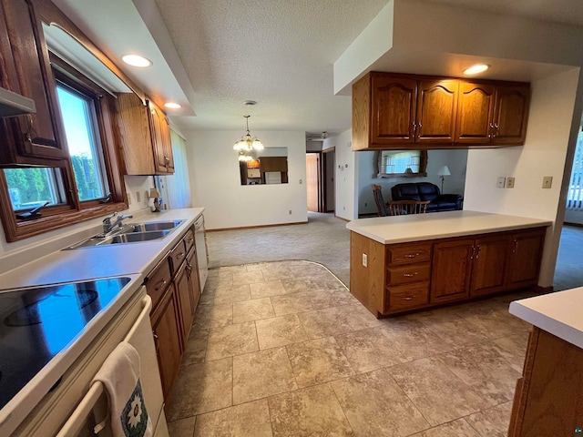 kitchen with electric stove, decorative light fixtures, light colored carpet, a chandelier, and sink