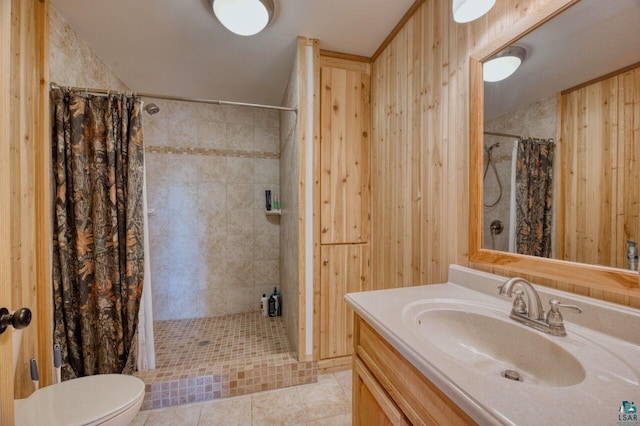 bathroom with wood walls, curtained shower, and vanity