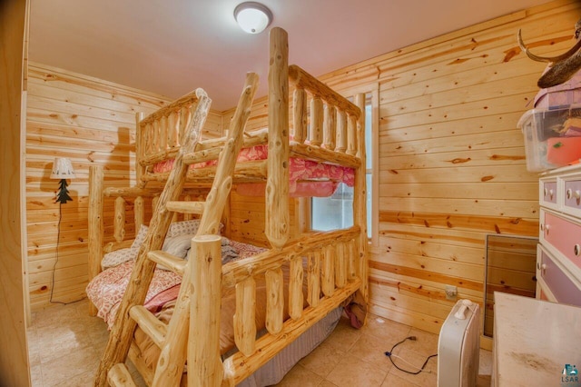 bedroom featuring wood walls