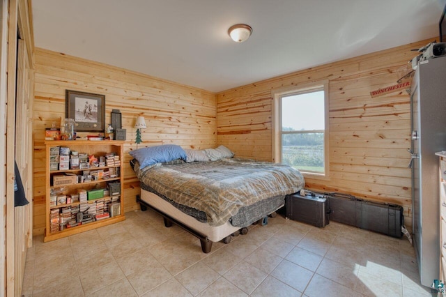 tiled bedroom featuring wood walls