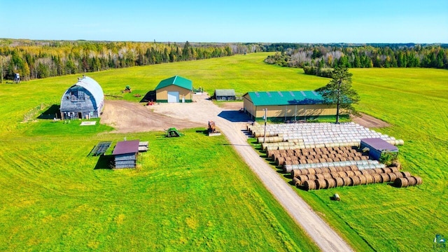 birds eye view of property with a rural view