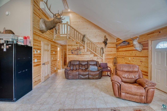 living room with tile patterned flooring, high vaulted ceiling, and wooden walls