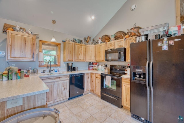 kitchen featuring hanging light fixtures, light brown cabinets, black appliances, and sink