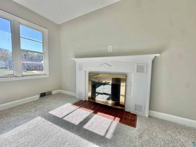 details with carpet floors and a tiled fireplace