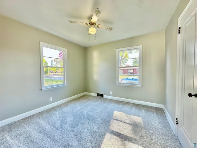 carpeted empty room with ceiling fan