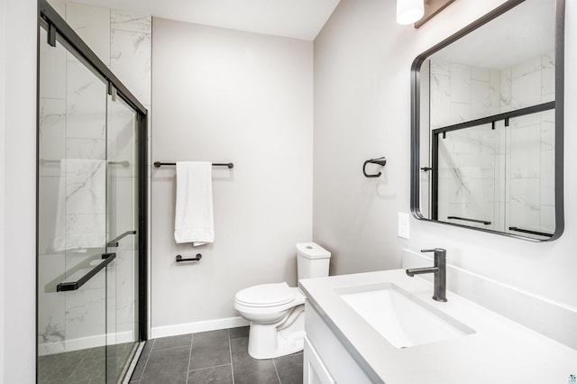 bathroom with an enclosed shower, tile patterned floors, vanity, and toilet