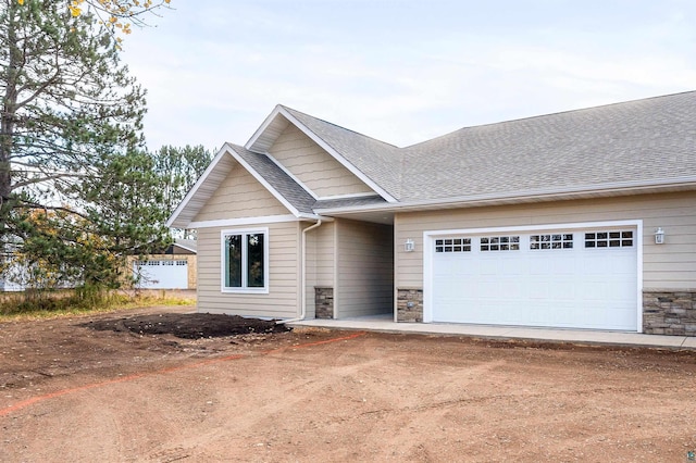 craftsman inspired home with a garage