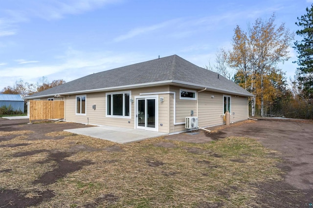 rear view of house featuring a patio area and ac unit