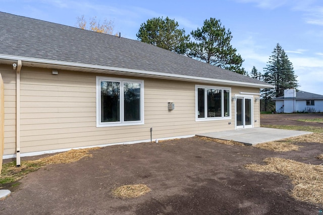 rear view of property featuring a patio area