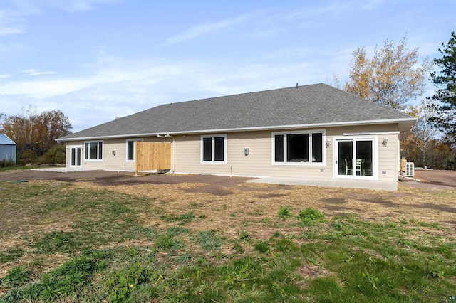 rear view of property featuring a patio