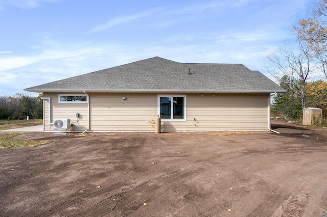 rear view of house featuring ac unit