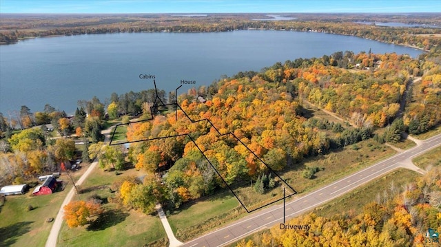 birds eye view of property with a water view