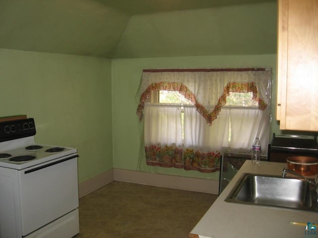 kitchen featuring sink, electric range, and vaulted ceiling