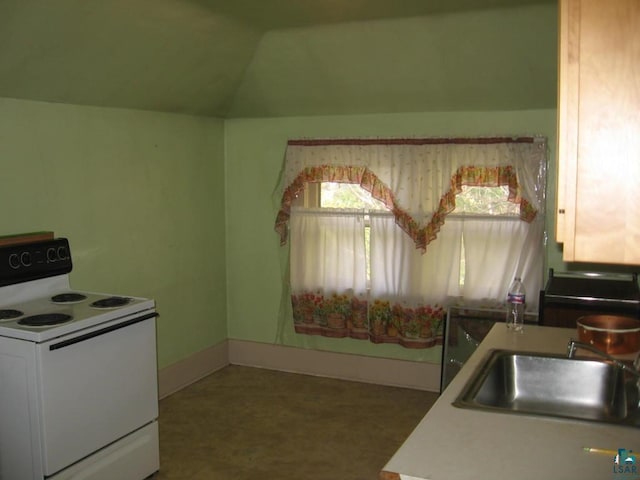 21 White St, Ely, MN 55731 - kitchen featuring white range with electric cooktop, a sink, vaulted ceiling, baseboards, and light countertops
