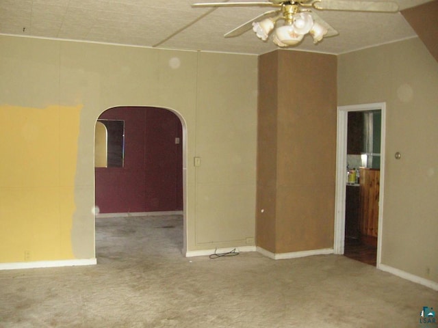 21 White St, Ely, MN 55731 - carpeted spare room with a ceiling fan, arched walkways, and baseboards