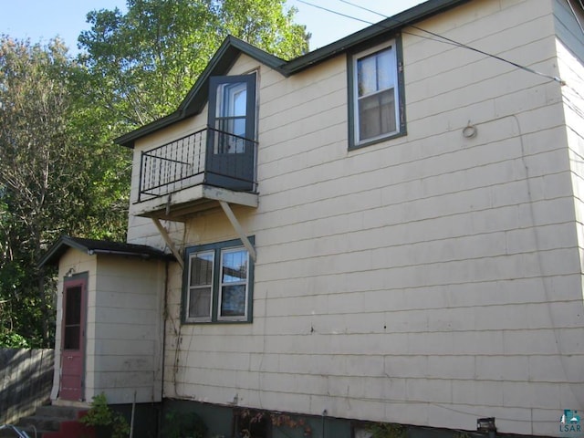 view of property exterior featuring a balcony