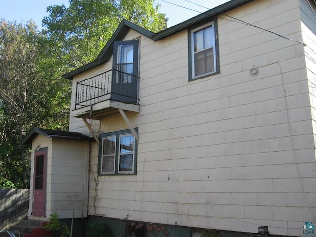 21 White St, Ely, MN 55731 - view of side of home with a balcony