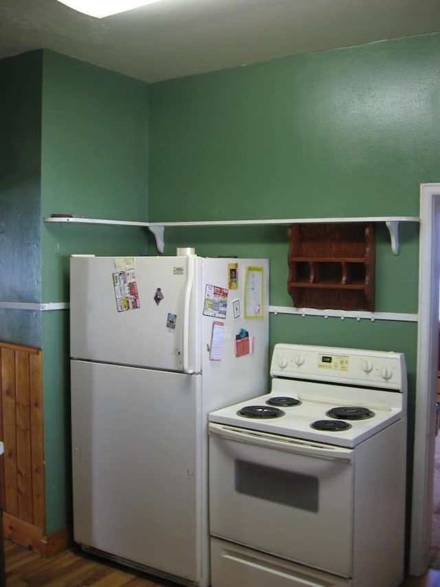 21 White St, Ely, MN 55731 - kitchen featuring white appliances and wood finished floors