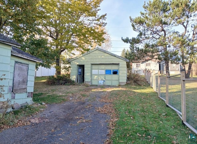 garage with a lawn