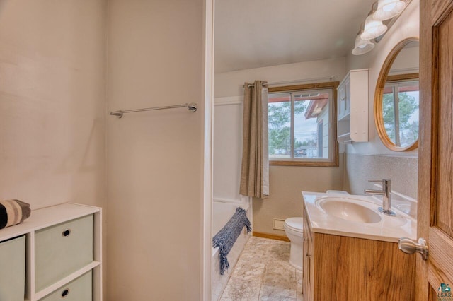 bathroom featuring toilet and vanity