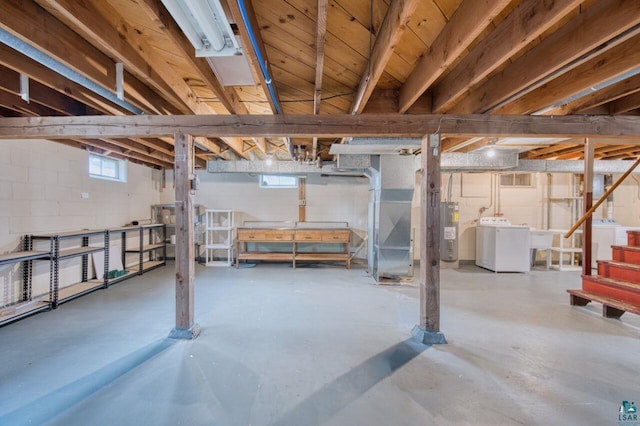 basement featuring water heater and washer and clothes dryer