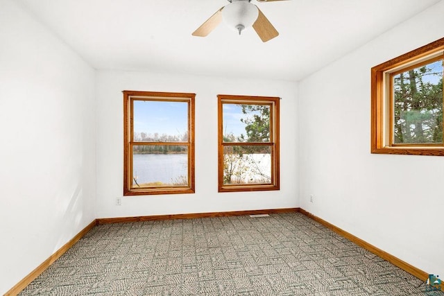 spare room featuring ceiling fan