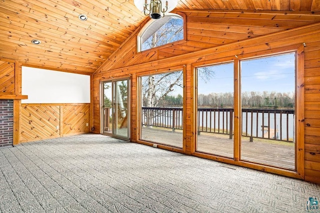 unfurnished sunroom with lofted ceiling, a water view, and wooden ceiling