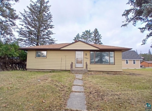 view of front of house with a front lawn