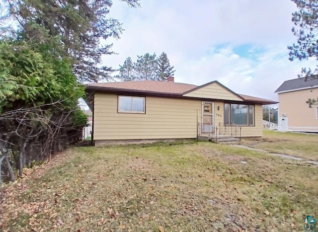 view of front of property with a front lawn