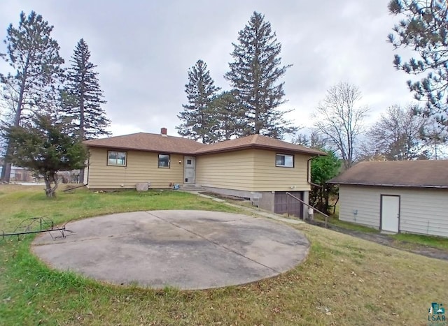 rear view of property with a patio area and a yard