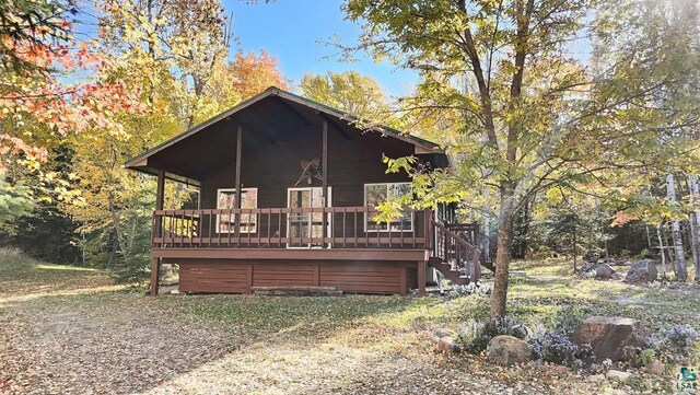 view of front of property with a wooden deck