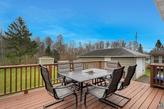 deck featuring a lawn and a storage shed