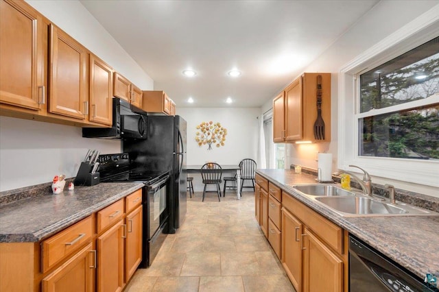 kitchen with sink and black appliances