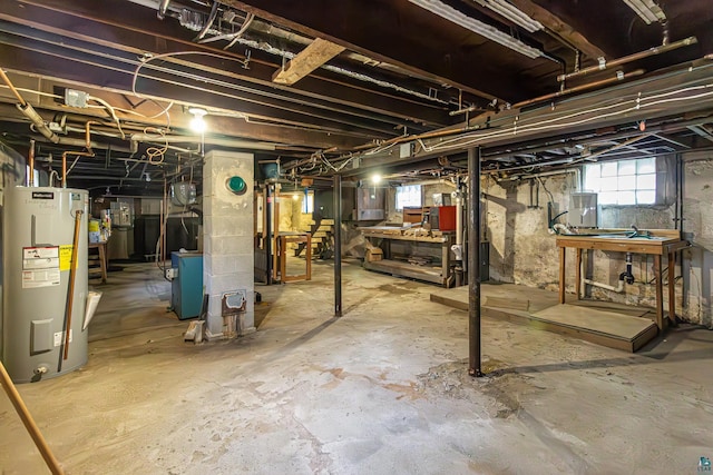 basement featuring water heater and electric panel