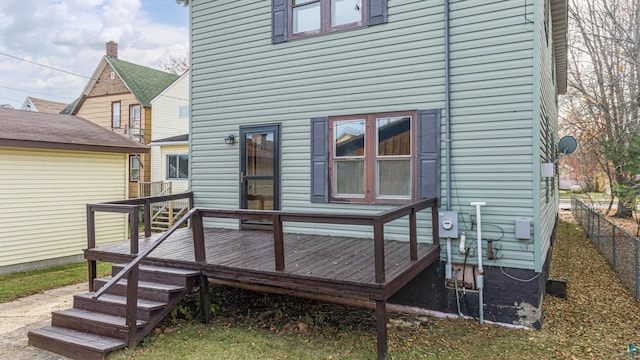 back of house featuring a wooden deck