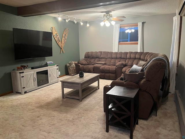 living room featuring beamed ceiling, light carpet, ceiling fan, a textured ceiling, and baseboard heating