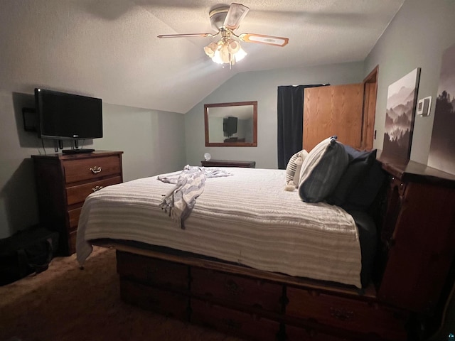 carpeted bedroom featuring ceiling fan, a textured ceiling, and vaulted ceiling