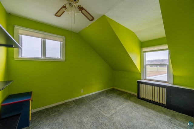 bonus room featuring light colored carpet, lofted ceiling, and a healthy amount of sunlight