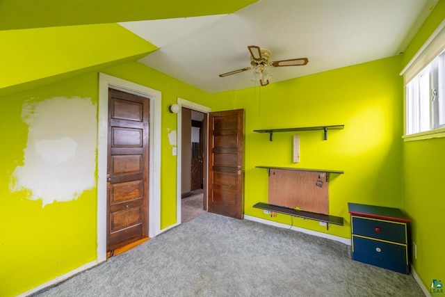 unfurnished bedroom featuring ceiling fan and carpet floors