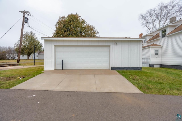 garage featuring a lawn