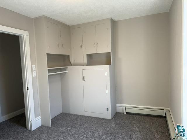 closet featuring baseboard heating