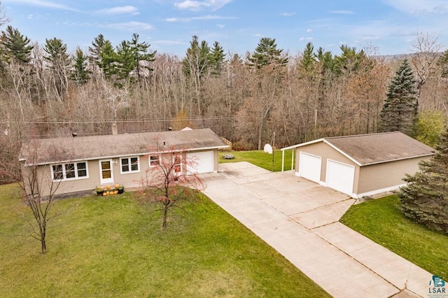 ranch-style home featuring an outbuilding and a front lawn